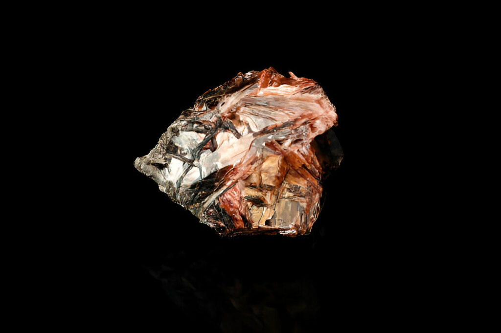 red Diaspore (also called zultanite) crystal isolated on black background