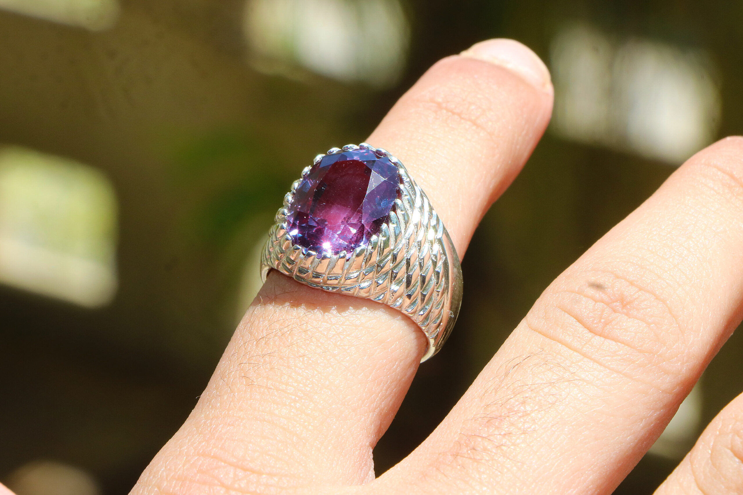 alexandrite ring a man wearing in sunlight