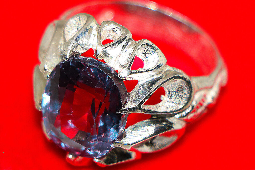 alexandrite men ring with red background 