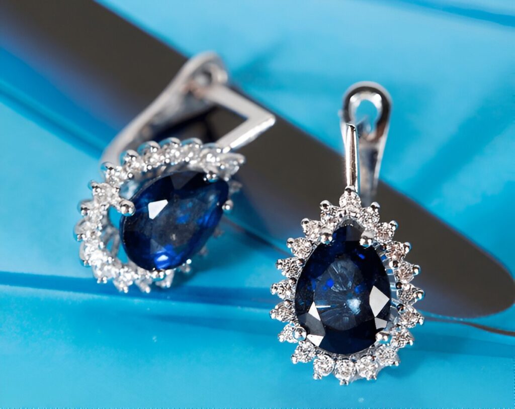 Sapphire diamond earrings on the background.